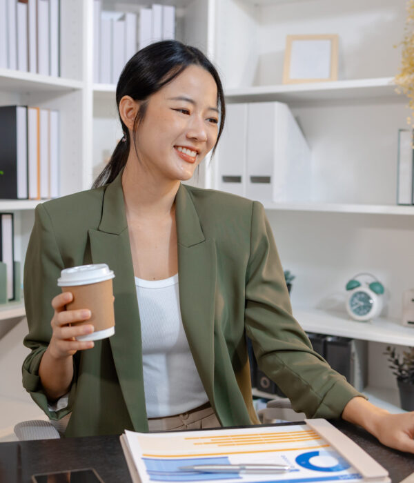 Young businesswoman working in a modern office, reviewing information and focusing on daily tasks with a professional mindset, representing productivity, responsibility, and modern corporate lifestyle